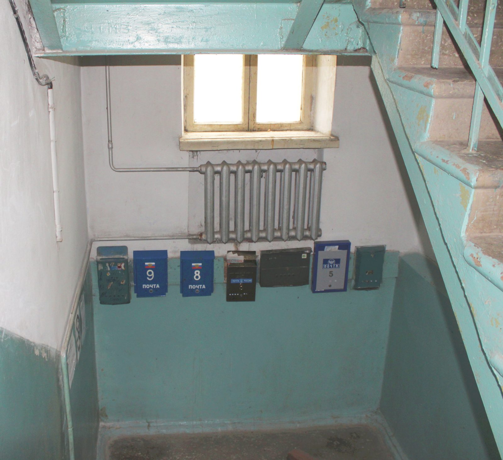 Cast-iron radiator on a Soviet-era staircase